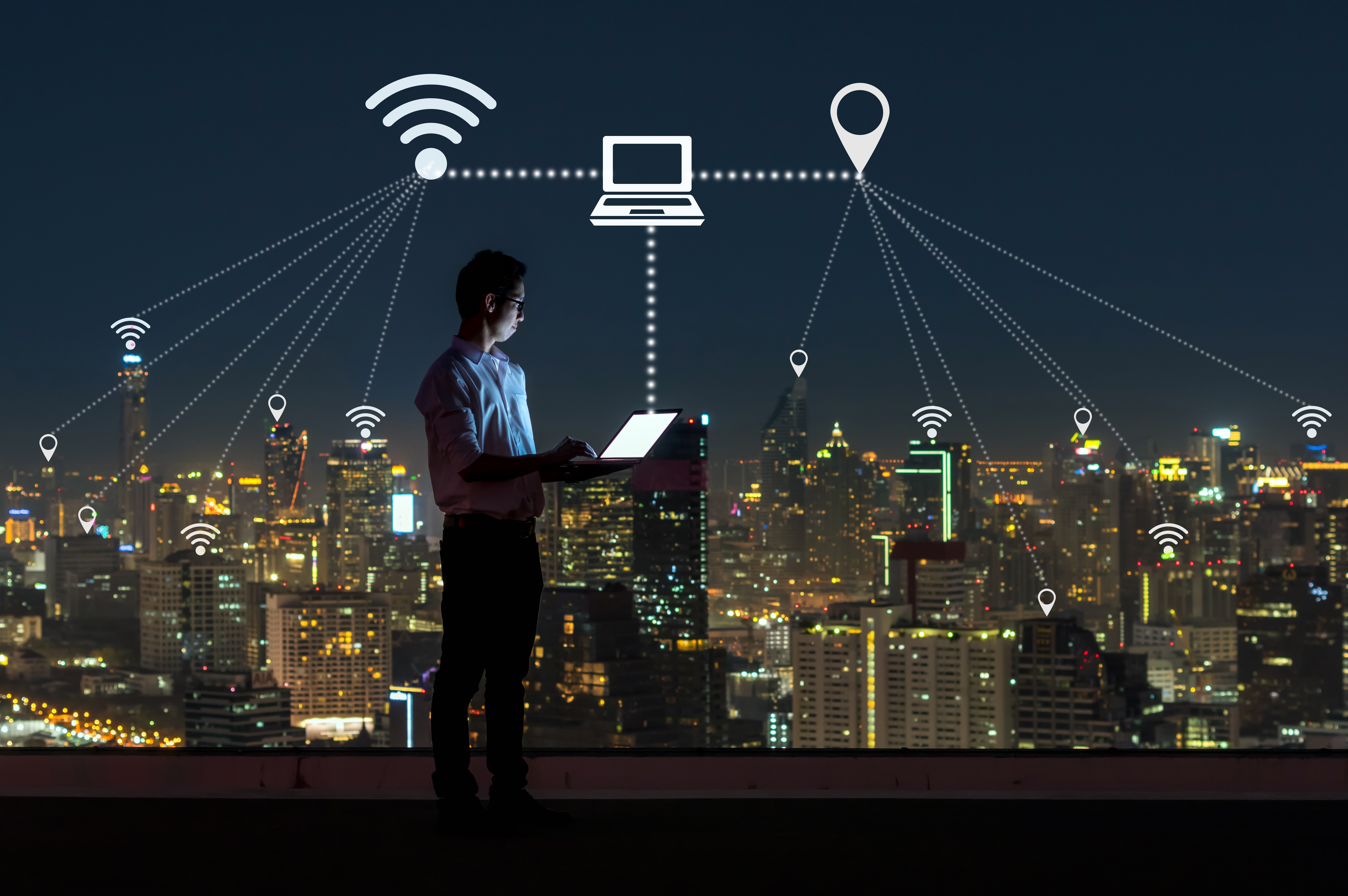 asian businessman standing and using the laptop for operate vari